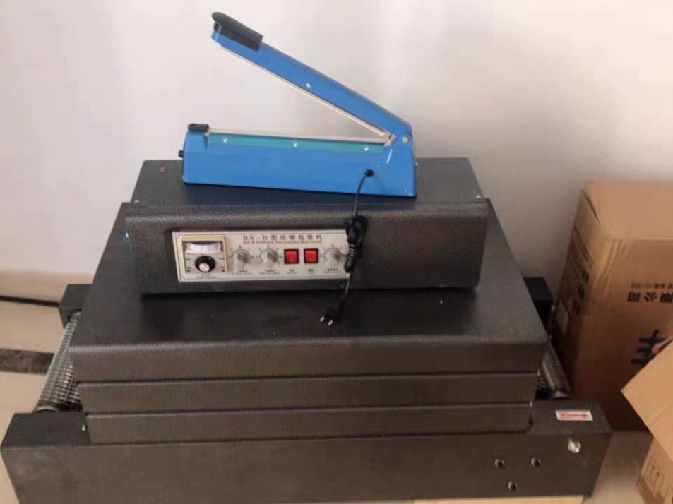 Горячая продажа Маленькая пластиковая пленка Тепловая туннель Сжимается режущая упаковочная машина для бутылки/коробки Легко работать